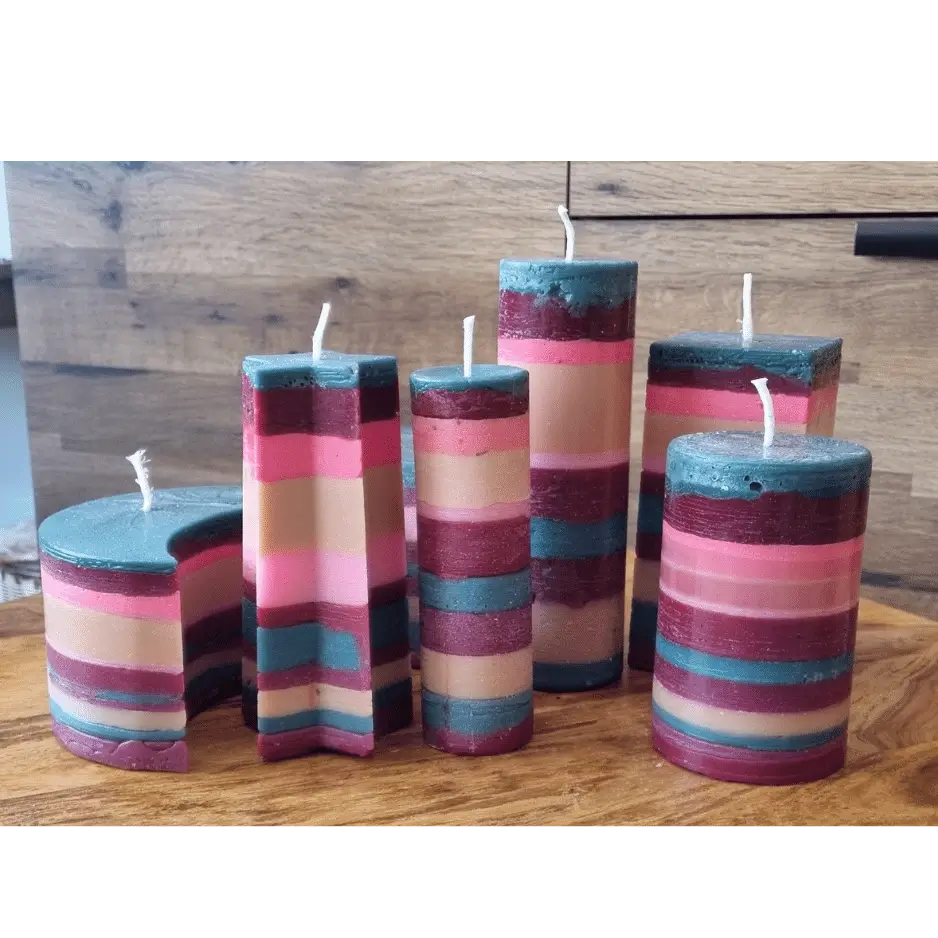 group of multi-coloured layered pillar candles