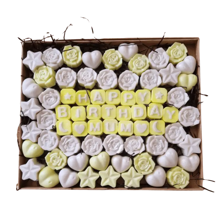 White and yellow wax melt roses, stars and hearts with the greeting Happy Birthday Mum made out of wax melt letters in a kraft box